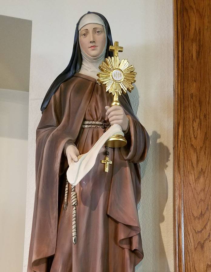 Statue of St. Clare holding a monstrance