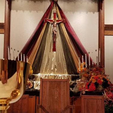 Church sanctuary with a draped crucifix
