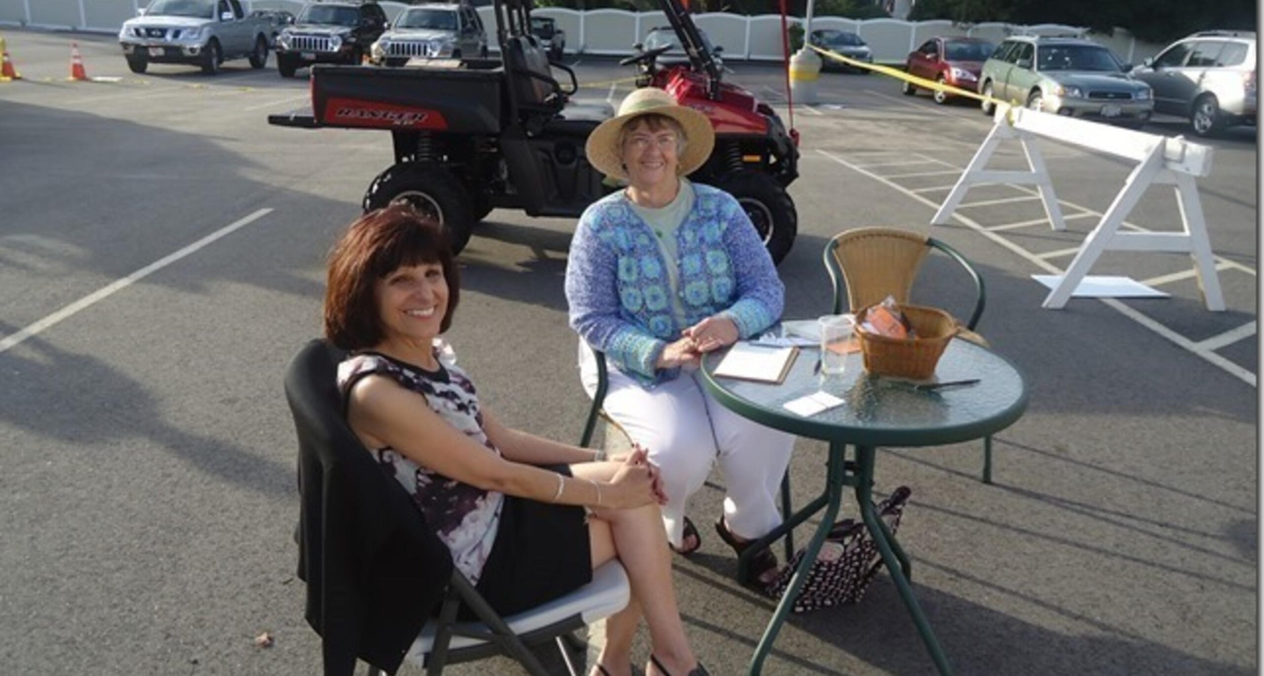 Parishioners seated at an outdoor table