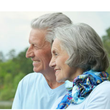 Older couple smiling outdoors